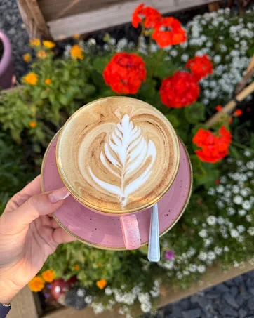 Latte art in the garden seating at Layla's Lounge